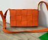 Женская сумка Bottega Veneta Padded Cassette кожаная оранжевая