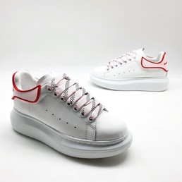 Кроссовки женские кожаные Alexander McQueen белые с розовыми шнурками