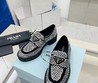 Женские лоферы Prada черные кожаные со стразами