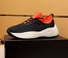 Мужские кроссовки Prada 2022-2023 черные с оранжевым и белой подошвой