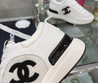 Женские летние кроссовки Chanel 2022 белые с черным логотипом