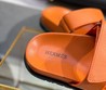 Женские кожаные сандалии Hermes 2022 оранжевые с черной подошвой