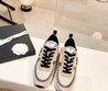Женские кроссовки Chanel 2022 бежевые с черными шнурками