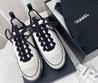 Женские кроссовки Chanel 2022 белые с черными шнурками