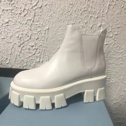 Женские ботинки Prada 2022-2023 белые кожаные высокие