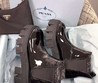 Женские глянцевые ботинки Prada 2022-2023 черные кожаные высокие