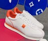 Женские кожаные кроссовки Valentino Garavani 2022-2023 белые с оранжевым