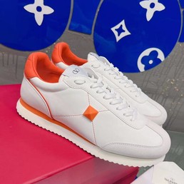 Женские кожаные кроссовки Valentino Garavani 2022-2023 белые с оранжевым