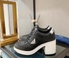 Женские кожаные кроссовки Prada 2022-2023 черные с белым