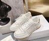 Женские кожаные кроссовки Christian Dior 2022-2023 белые с золотом и перфорированной вставкой