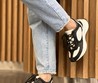 Женские кожаные кроссовки Gucci 2022-2023 черные с белым и фирменным принтом