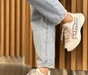 Женские кожаные кроссовки Gucci 2022-2023 белые с фирменным принтом красного и синего цвета
