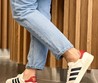 Женские кожаные кроссовки Gucci 2022-2023 белые с черными полосами