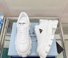 Женские кожаные кроссовки Prada 2022-2023 белые с эмблемой