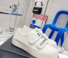 Женские текстильные кроссовки Chanel 2023-2024 белые с логотипом