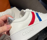 Женские кожаные кроссовки Celine 2023-2024 белые с синей и красной полосой