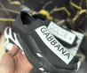 Мужские текстильные кроссовки Dolce & Gabbana 2023-2024 черные c логотипом на белом фоне