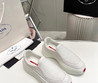 Мужские текстильные кроссовки  Prada 2023-2024  белые с красной полосой
