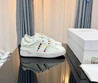 Женские кожаные кроссовки Valentino 2023-2024 белые с цветным украшением сбоку