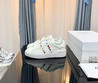 Женские кожаные кроссовки Valentino 2023-2024 белые с цветным украшением сбоку