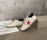 Женские кожаные кроссовки Golden Goose 2023-2024 белые с черным и красной звездой