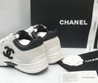 Женские комбинированные кроссовки Chanel 2023-2024 белые с черным логотипом