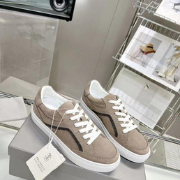 Женские замшевые кеды Brunello Cucinelli 2023 коричневые с черной полосой