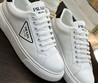 Женские кожаные кроссовки Prada 2023 белые с черным