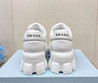 Женские кожаные ботинки Prada 2023 белые с металлическим логотипом