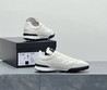 Женские кожаные кроссовки Chanel 2023 белые с черным