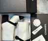 Женские кожаные сапоги Chanel 2023 белые с черным бантиком