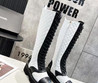 Женские кожаные сапоги Chanel 2023 черные с белым на шнурках