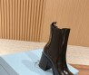 Женские кожаные сапоги Prada 2023 черные на каблуке