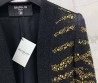 Женский костюм Balmain 2023 черный с золотым украшением