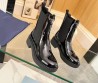 Женские кожаные сапоги Prada 2023 черные лакированные