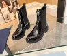 Женские кожаные сапоги Prada 2023 черные лакированные