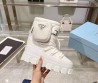 Женские луноходы Prada 2023 белые с накладным карманом