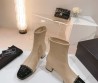 Женские кожаные сапоги Chanel 2024 бежевые с черным носком