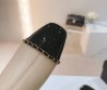 Женские кожаные сапоги Chanel 2024 бежевые с черным носком