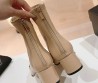 Женские кожаные сапоги Chanel 2024 бежевые с черным носком