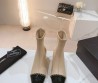 Женские кожаные сапоги Chanel 2024 бежевые с черным носком