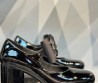 Женские кожаные туфли Chanel 2023 черные лакированные с бантом