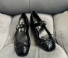 Женские кожаные туфли Miu Miu 2024 черные под рептилию с бантиком