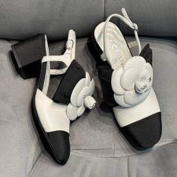 Женские комбинированные туфли Chanel 2024 белые с черным с цветком
