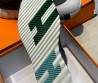 Мужские комбинированные кроссовки Hermes 2024 серые с зеленой буквой