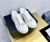 Женские текстильные кеды Chanel 2024 белые с золотистым значком