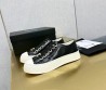 Женские кожаные кеды Chanel 2024 черные лакированные с золотистым значком