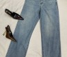 Женские джинсы Saint Laurent 2024 синие с эмблемами на кармане