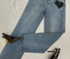 Женские джинсы Saint Laurent 2024 синие с эмблемами на кармане
