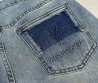 Женские джинсы Saint Laurent 2024 синие с эмблемами на кармане